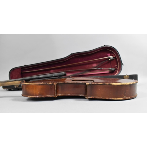 175 - A Cased Violin with Two Bows, In need of Substantial Restoration and Repair