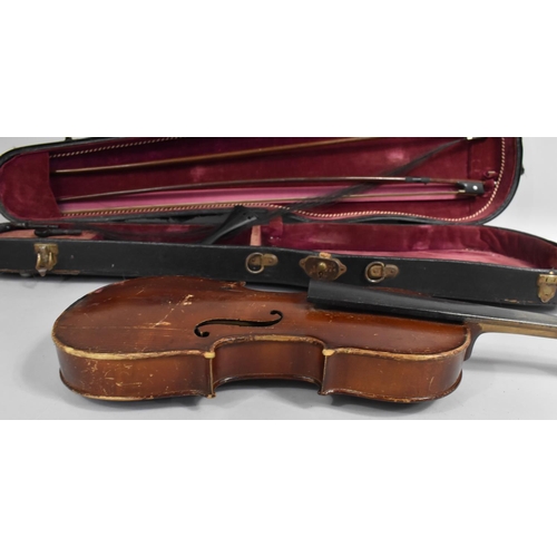 175 - A Cased Violin with Two Bows, In need of Substantial Restoration and Repair