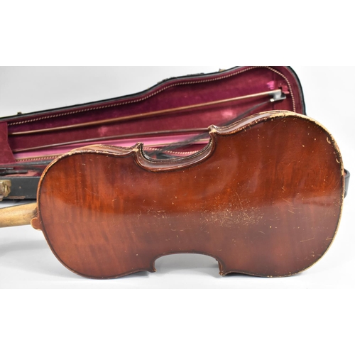 175 - A Cased Violin with Two Bows, In need of Substantial Restoration and Repair