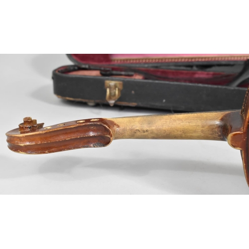 175 - A Cased Violin with Two Bows, In need of Substantial Restoration and Repair