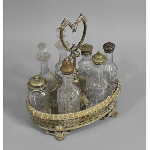 46 - An Early 20th Century Seven Bottle Cruet, with Scrolled Feet, 26cms High