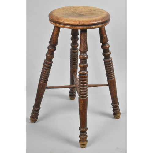 53 - An Edwardian Circular Topped Stool, 61cms High