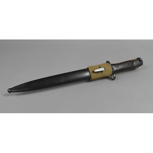 98 - A Wooden Handled Bayonet in Metal Scabbard