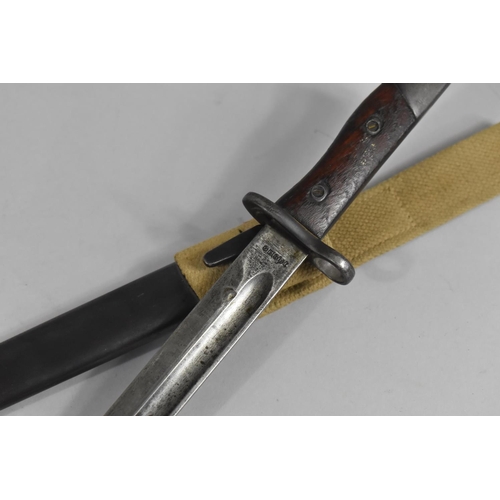 98 - A Wooden Handled Bayonet in Metal Scabbard