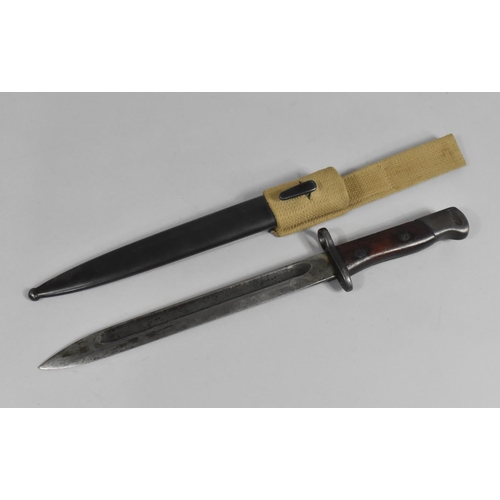 98 - A Wooden Handled Bayonet in Metal Scabbard