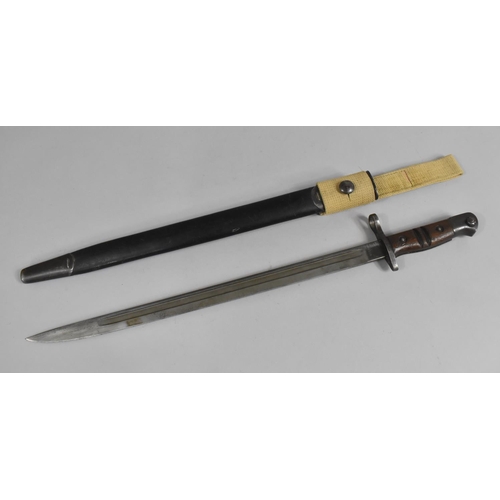 99 - A Wooden Handled Remington WWI Period Bayonet, the Blade Stamped and Dated 1913, 57cm Long Overall