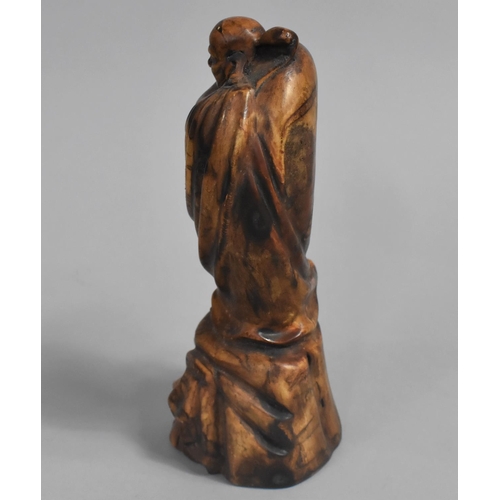 36 - A Chinese Carved Study of Robed Imortal on Rock, 18cms High