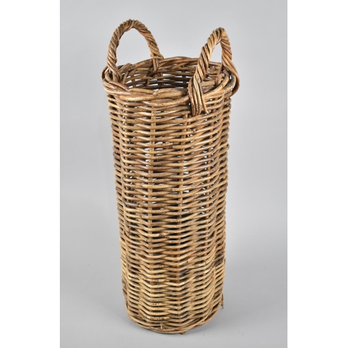 72 - A Cylindrical Wicker Stick Stand with Two Carrying Handles, 24cms Diameter and 60cms High