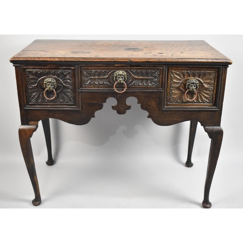 76 - A 19th Century Oak Lowboy on Extended Cabriole Supports with Later Carved Centre Drawer flanked by T... 