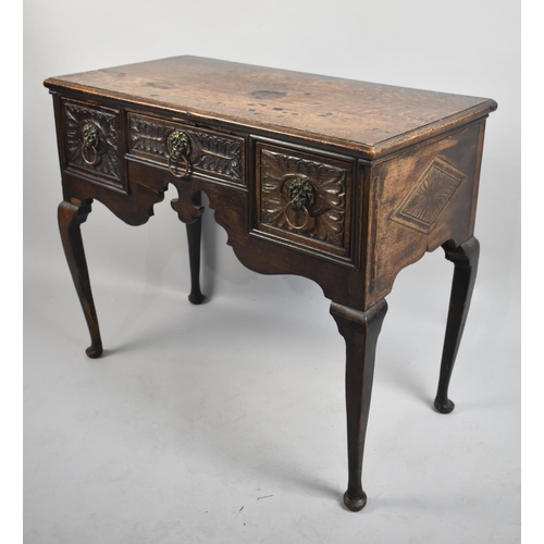 76 - A 19th Century Oak Lowboy on Extended Cabriole Supports with Later Carved Centre Drawer flanked by T... 