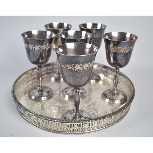 80 - A Circular Silver Plated Pierced Galleried Tray together with Six Silver Plated Goblets