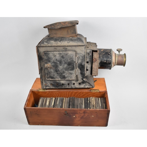 100 - A Vintage Metal Magic Lantern, Missing Burner Together with a Collection of Various Magic Lantern Sl... 