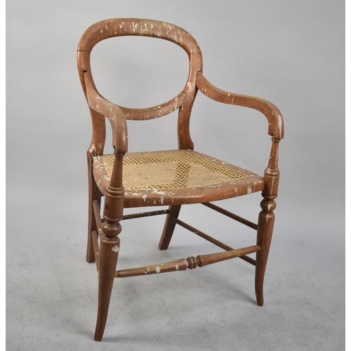 419 - A Cane Seated Armchair in Need of Some Restoration