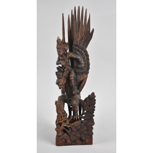 64 - A Far Eastern Detailed Carving of Ka on the Shoulders of Winged Beast, Some Losses, 34cms High