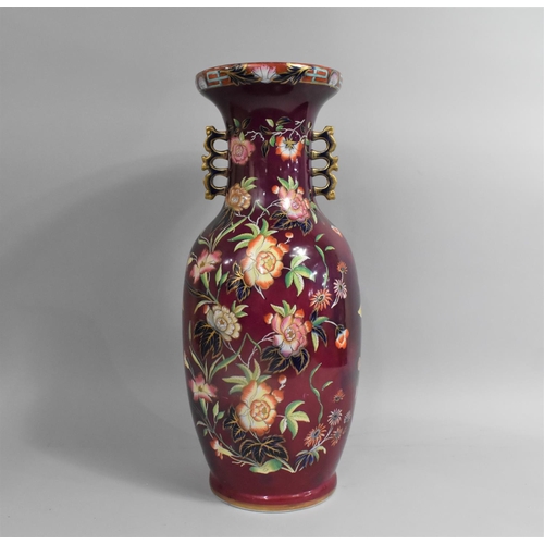 70 - A Large Modern oriental Decorative Two Handled Vase on Maroon Ground with Multi Coloured Enamelled F... 