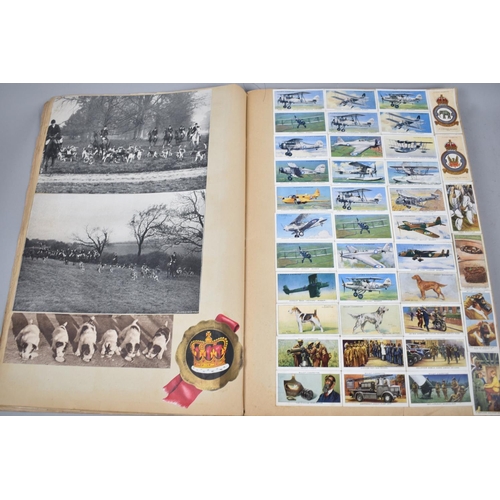 81 - A Vintage Scrapbook Containing Cigarette Cards, Magazine Pages, Prints etc