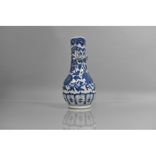 360 - A Chinese Blue and White Vase of Bottle Form having Applied Crawling Dragon to Neck, 27cms High