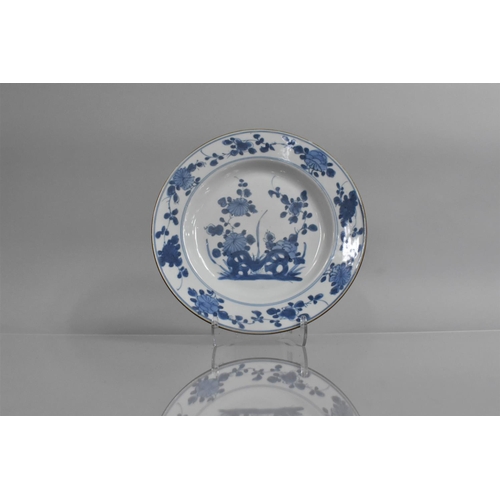 350 - An 18th/19th Century Chinese Blue and White Plate decorated with Blossoming Flowers and Floral Borde... 