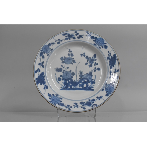 350 - An 18th/19th Century Chinese Blue and White Plate decorated with Blossoming Flowers and Floral Borde... 