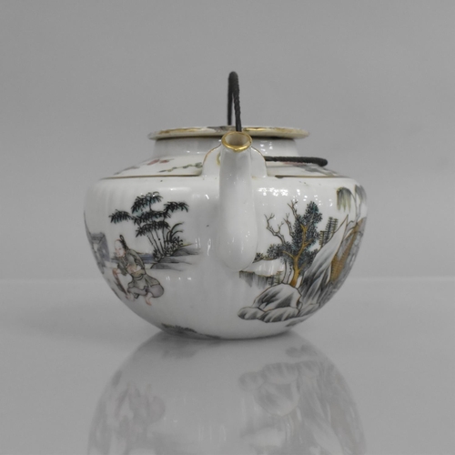 314 - A Chinese Porcelain Teapot of Squat Reeded Form decorated in the Famille Rose Palette with Figures a... 