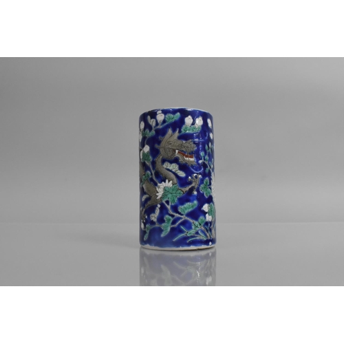 310 - A Late 19th/Early 20th Century Chinese Porcelain Cylindrical Brush Pot decorated with Dragons on Blu... 