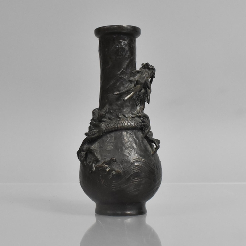 276 - A Small Japanese Bronze Bottle Vase, Decorated in Relief with Crawling Dragon, 14cms High