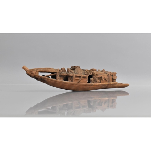 268 - A Chinese Carved Bamboo Model of a Traditional Fishing Boat having Carved Detail and Figures, 26cms ... 