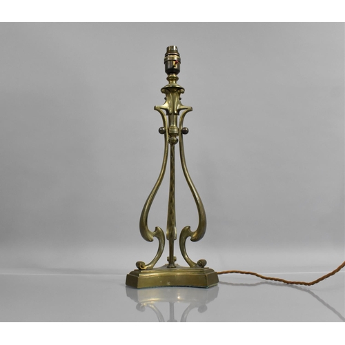 157 - An Edwardian Brass Table Lamp of Triform Shape with Scrolled Supports and Centre Twisted Pole, plint... 