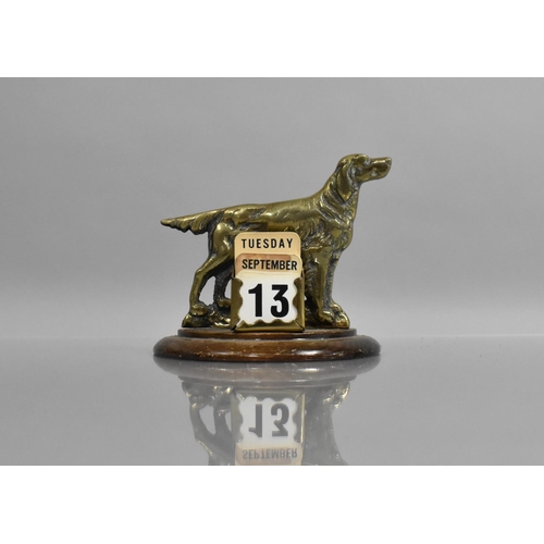 67 - A Novelty Brass Desk Top Calendar in the Form of Spaniel, Demi Lune Wooden Stand, 13cms Wide