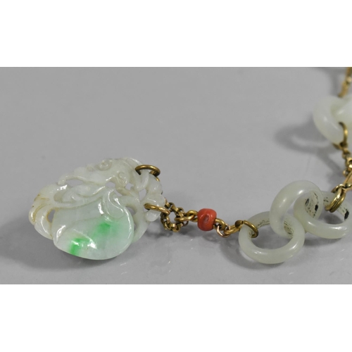 254 - A Chinese Jade and Gold Coloured Metal Necklace, Having Carved Peach Pendant Surmounted by Coral Bea... 