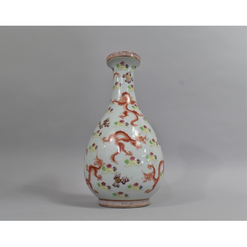 304 - A Chinese Porcelain Vase of Bottle Form decorated with Red Dragons amongst Scrolled Sky Chasing Flam... 