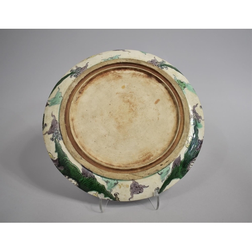 335 - A 17th/18th Century Chinese Porcelain Dish decorated in the Famille Verte palette depicting Exterior... 