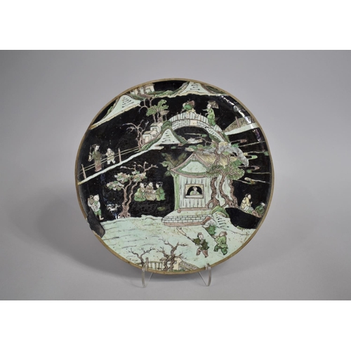 335 - A 17th/18th Century Chinese Porcelain Dish decorated in the Famille Verte palette depicting Exterior... 