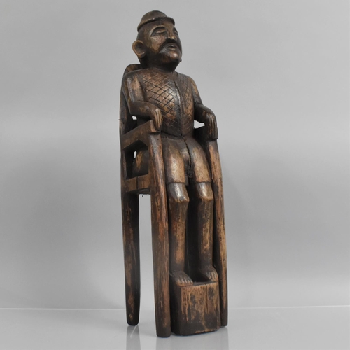 143 - A 19th Century Indonesian Carved Hardwood Figure of a Tribal Elder Seated on a Tall Throne, 49cm hig... 