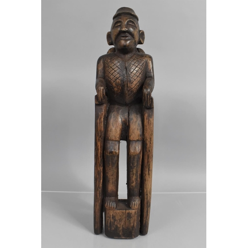 143 - A 19th Century Indonesian Carved Hardwood Figure of a Tribal Elder Seated on a Tall Throne, 49cm hig... 