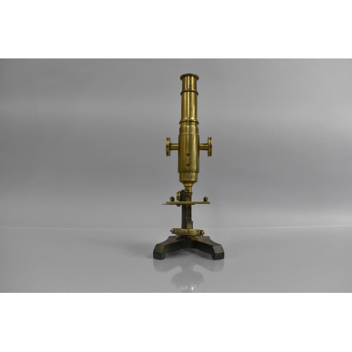 164 - A Late 19th Century Brass Microscope Mounted on an Iron Stand, 26cm high