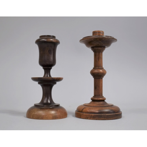 61 - Two Treen Candlesticks, 14cms and 13cms High