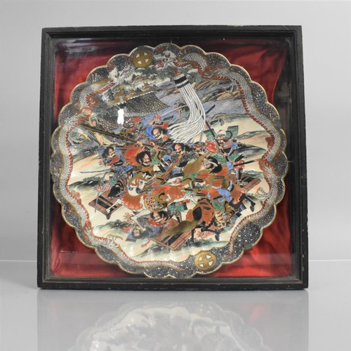 296 - A Japanese Meiji Scalloped  Edged Charger decorated in Polychrome Enamels depicting Battle Scene, Re... 