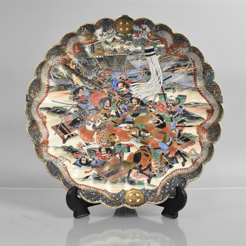 296 - A Japanese Meiji Scalloped  Edged Charger decorated in Polychrome Enamels depicting Battle Scene, Re... 