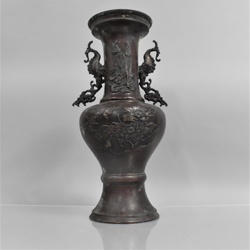 174 - A Japanese Bronze Meiji Period Patinated Two Handled Vase, Body and Neck decorated in Relief, 35cms ... 