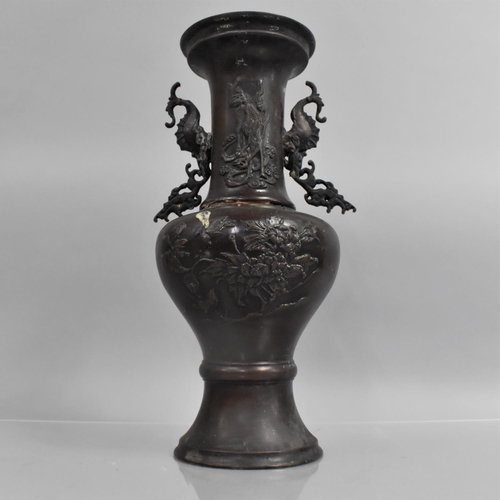 174 - A Japanese Bronze Meiji Period Patinated Two Handled Vase, Body and Neck decorated in Relief, 35cms ... 