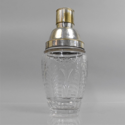 260 - An Art Deco Influenced Heavy Cut Glass Cocktail Shaker with Silver Plated Collar and Pourer. 25cms H... 