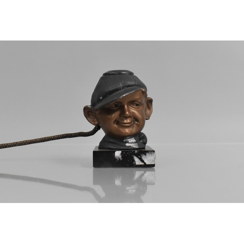 64 - A 1930's American Novelty Electric Cigar or Cigarette Lighter in the Form of a Boy Wearing Cap and S... 