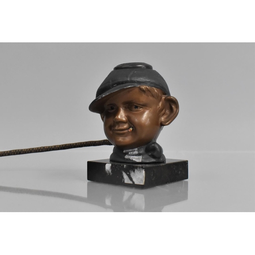 64 - A 1930's American Novelty Electric Cigar or Cigarette Lighter in the Form of a Boy Wearing Cap and S... 