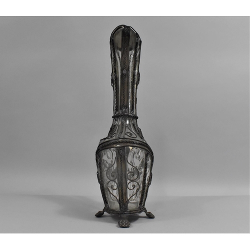 129 - A Continental Wire Mounted Glass Claret Jug with Hinged Lid and Claw Feet, 32cms High