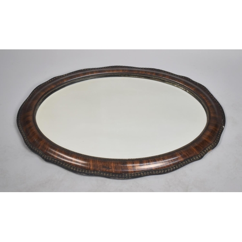 222 - A Vintage Oval Cushion Framed Wall Mirror, 87cm wide