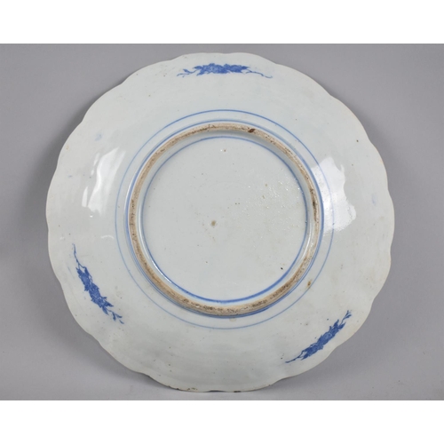 237 - A Japanese Blue and White Charger with Scalloped Edge, 30cm diameter