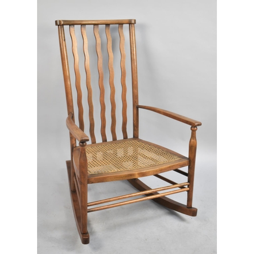 473 - A Vintage Cane Seated Rocking Chair with Wavy Splat Back