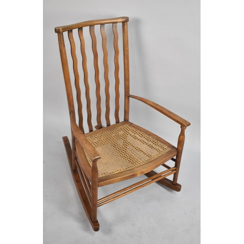 473 - A Vintage Cane Seated Rocking Chair with Wavy Splat Back