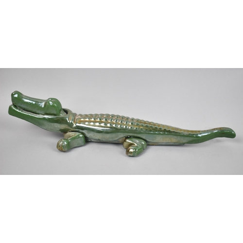 65 - An Early 20th Century Green Enamelled Cast Iron Novelty Nutcracker in the Form of a Crocodile, 34cms... 